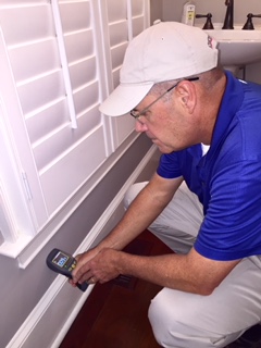 Wallace Preforming Interior Home inspection with laser thermometer